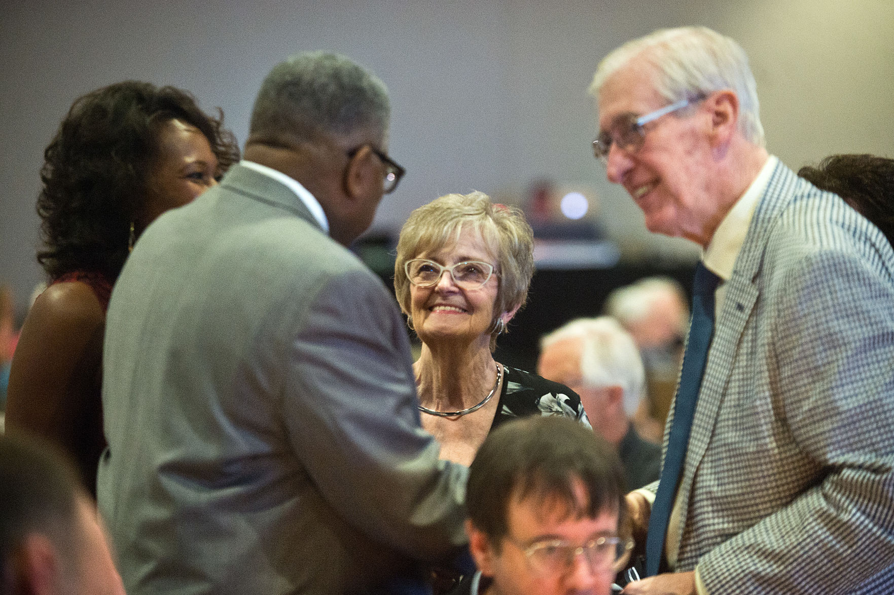 Carla Barnes and Willie Brown congratulate Judy and Rich Buchanan